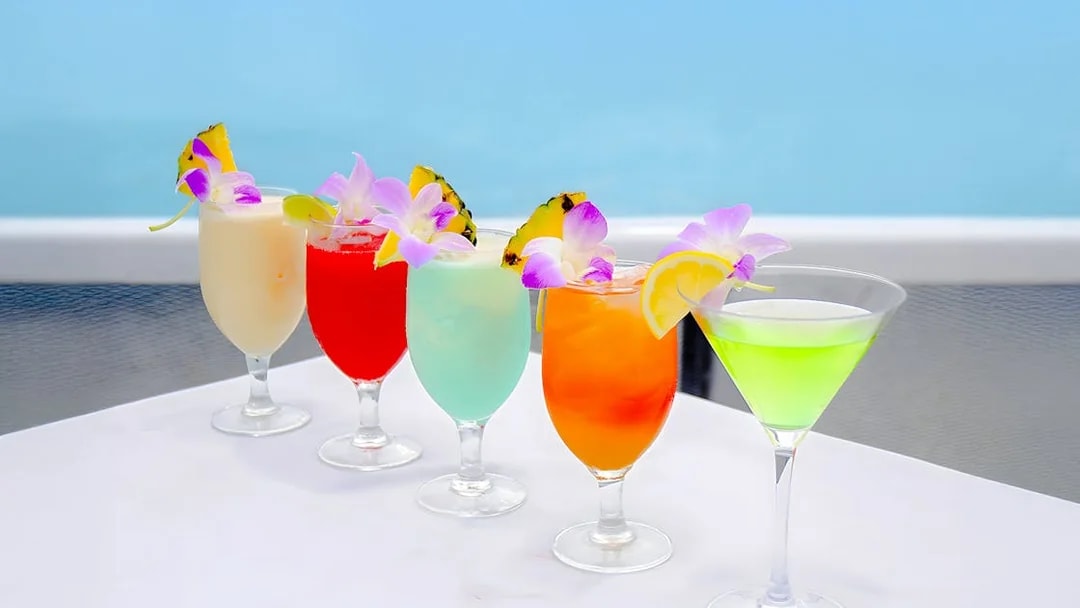 Colorful cocktails with tropical garnishes on the Star of Honolulu, Three Star cruise.