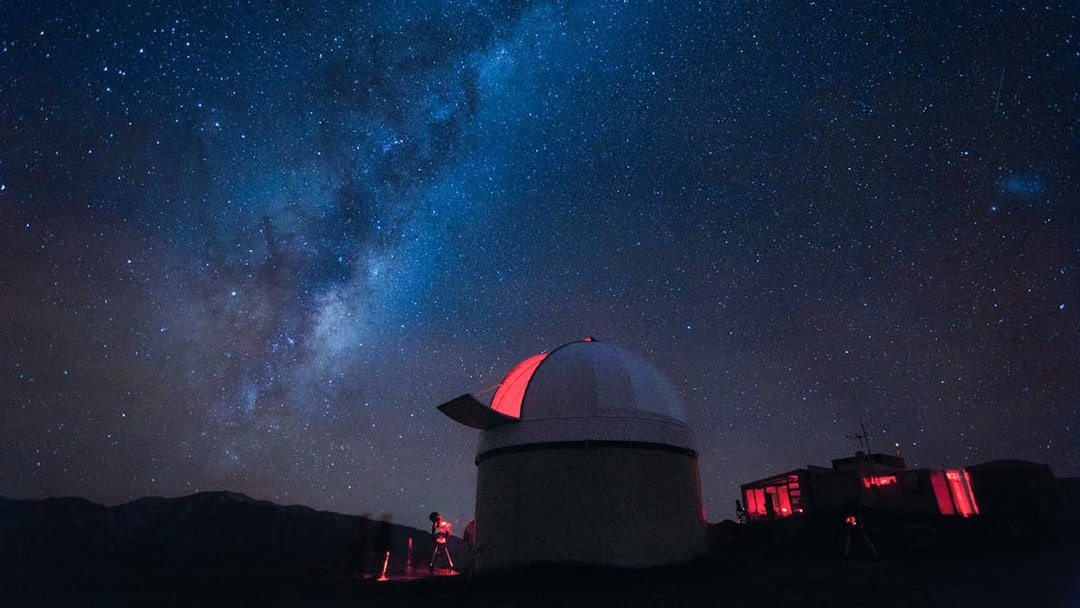 Stargazing at Mt. John Observatory under a starry sky, New Zealand.