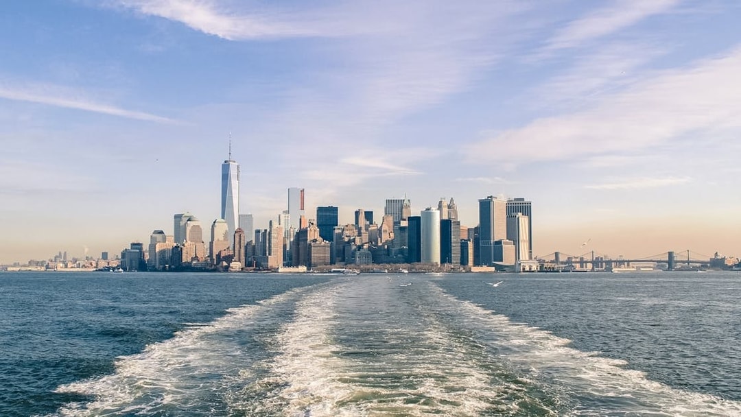 New York City skyline from Statue of Liberty Ellis Island sunset cruise.