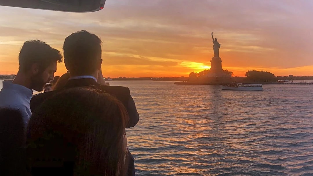 Sunset view of the Statue of Liberty from an Ellis Island cruise.