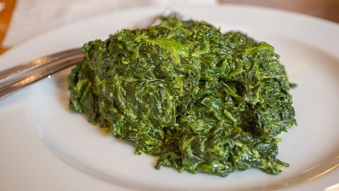 Creole Creamed Spinach served on Steamboat Natchez Dinner cruise plate.
