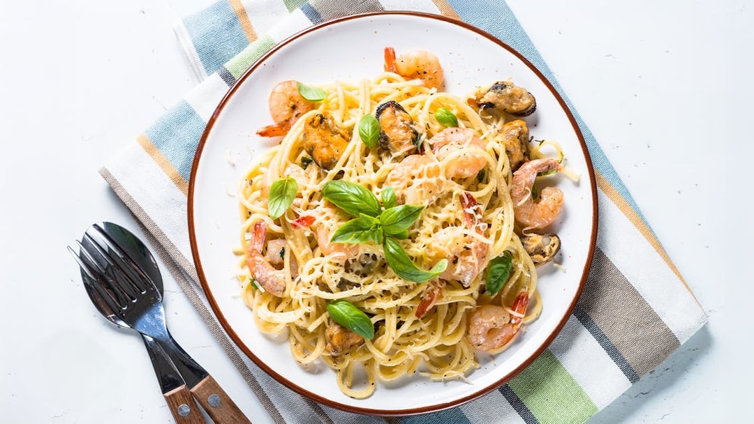 Seafood pasta with cream sauce served on Steamboat Natchez Evening Dinner Cruise.