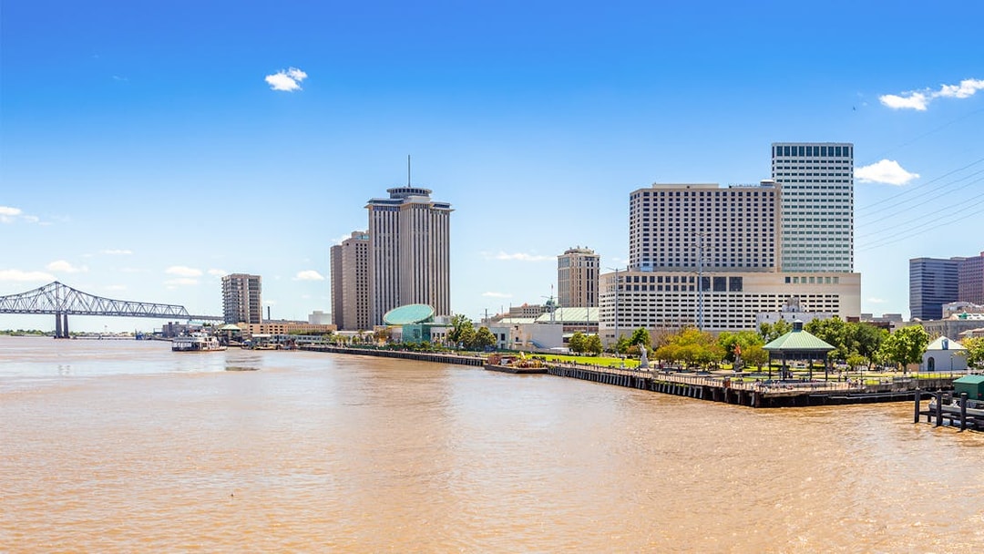New Orleans skyline with business district skyscrapers viewed from Mississippi River, Louisiana.