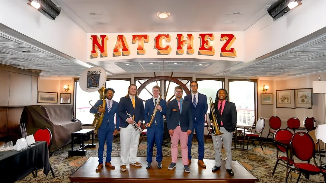 Dukes band members with instruments on Steamboat Natchez in New Orleans.