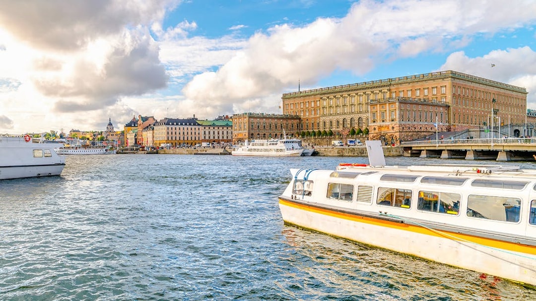 Strandvagskajen Promenade view with boats on Djurgrden City Canal Cruise.