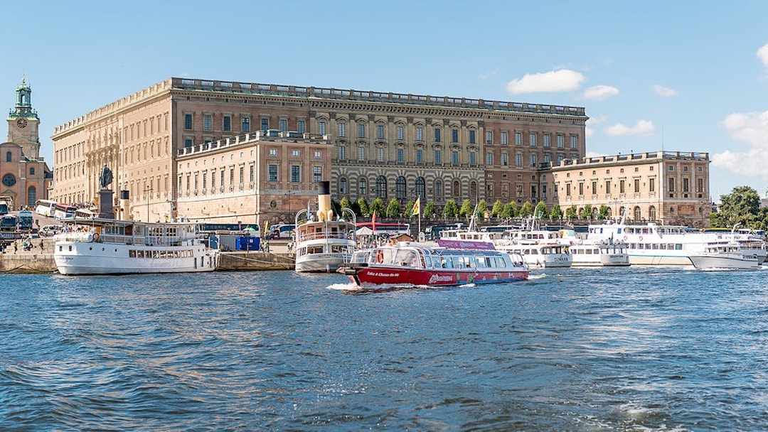 Boats on the water near the Royal Palace in Stockholm, Sweden.