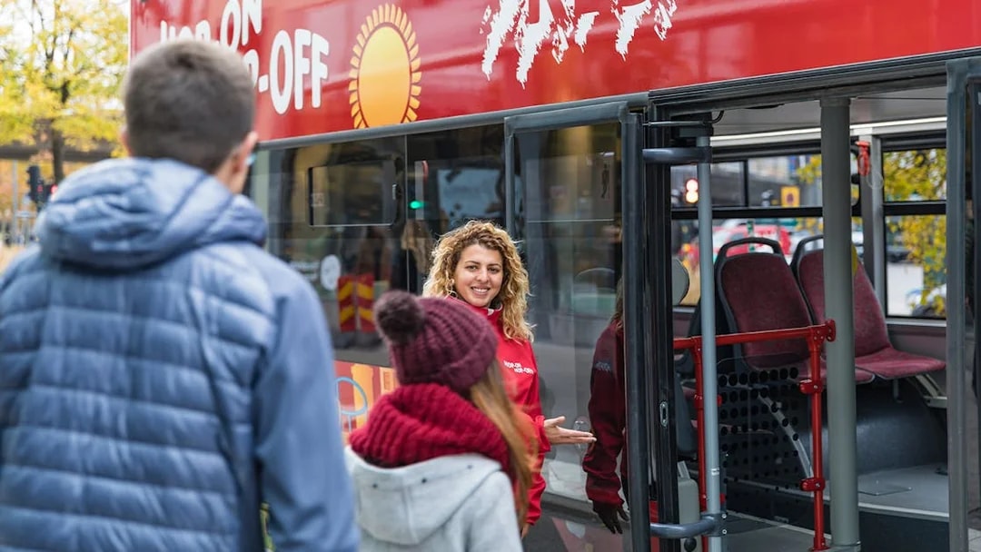 People boarding hop-on hop-off bus in Stockholm.