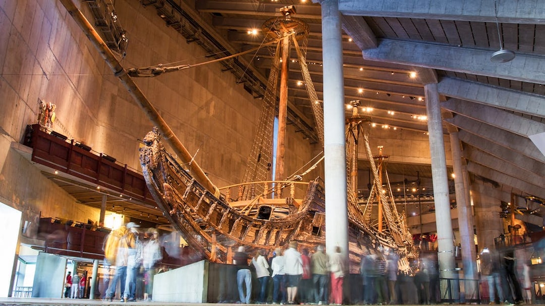 Vasa Museum ship exhibit with visitors in Stockholm.