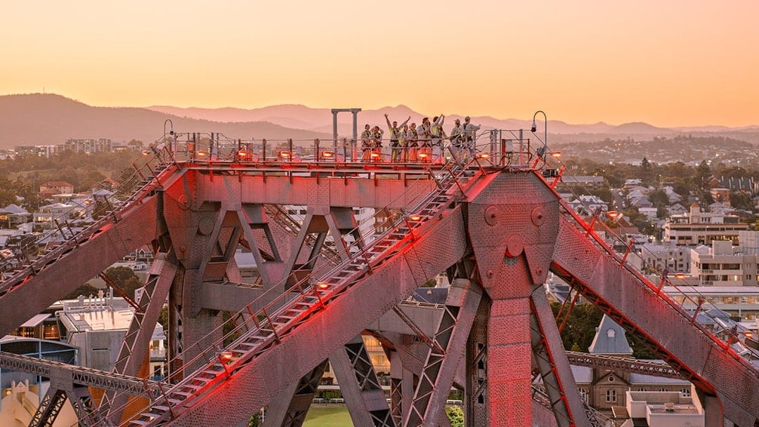 Climbers on Story Bridge during twilight in Brisbane, Australia.