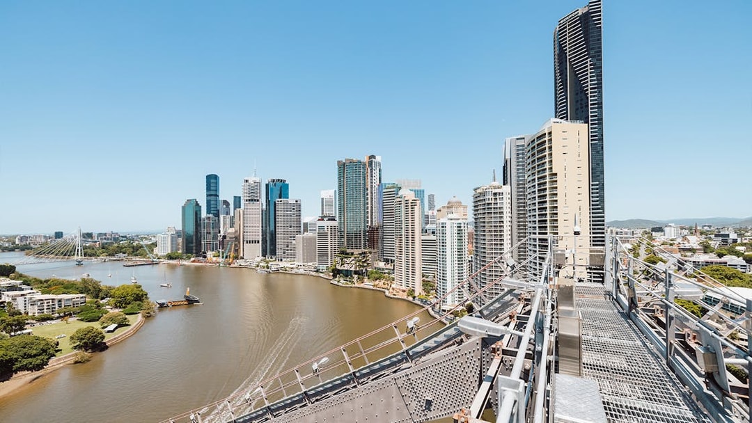 Brisbane city skyline and river viewed from Story Bridge Adventure Climb walkway.