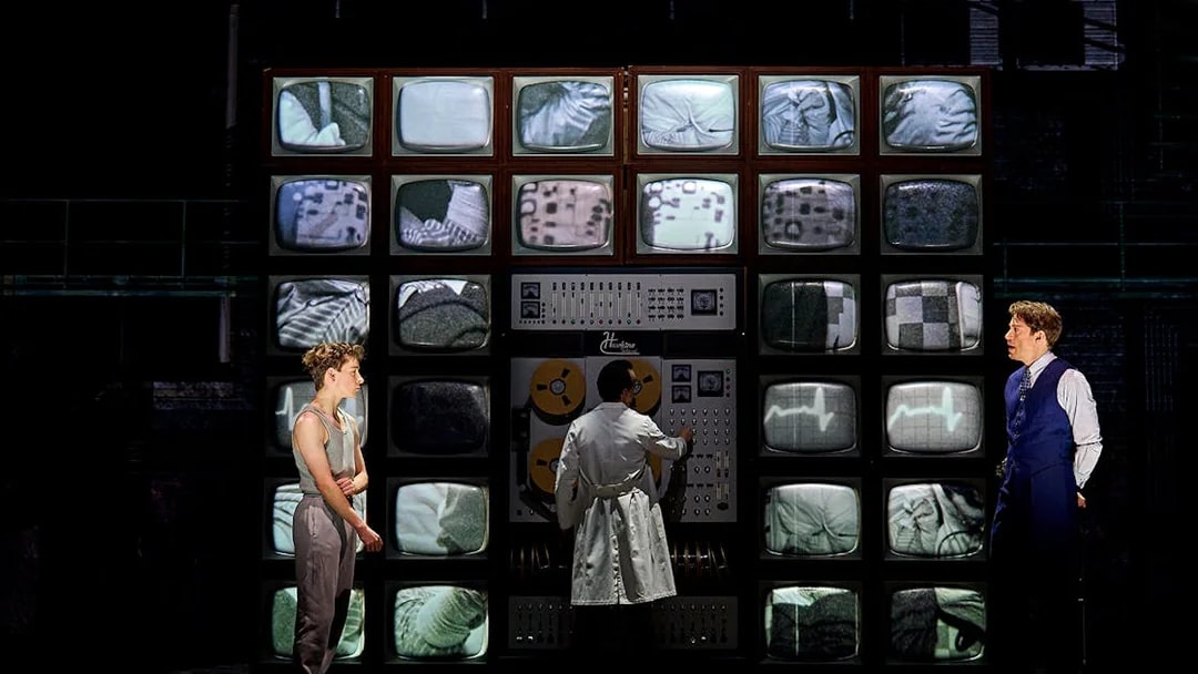 Control room scene from Stranger Things: The First Shadow with characters and vintage monitors.