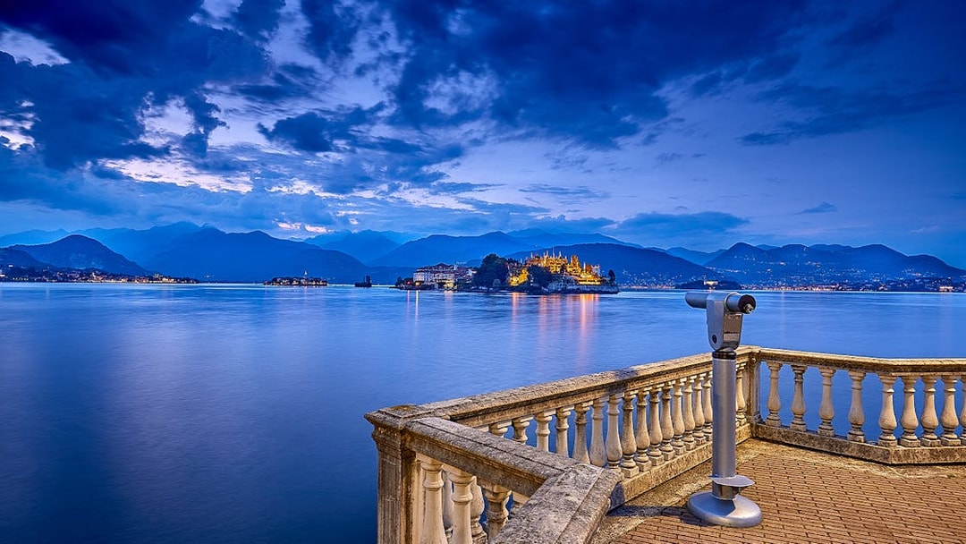 View of Isola Bella from a lakeside terrace with telescope, Isole Borromee tour.