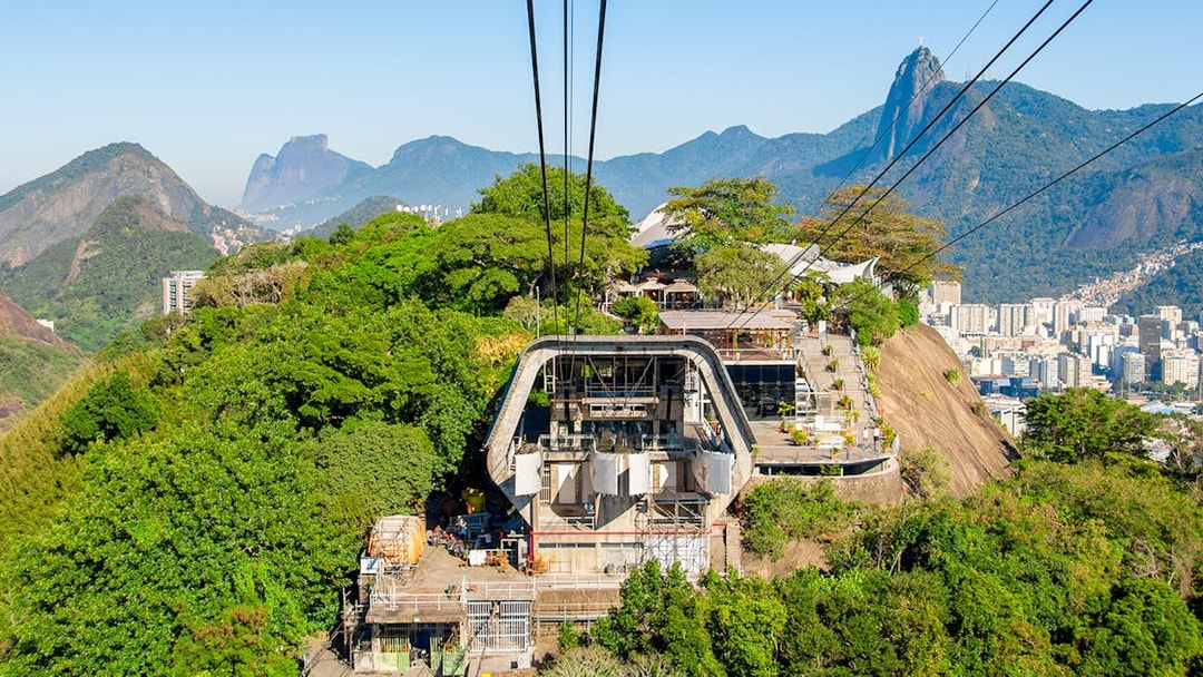 Cable car station on Urca Mountain with Rio de Janeiro cityscape in the background.