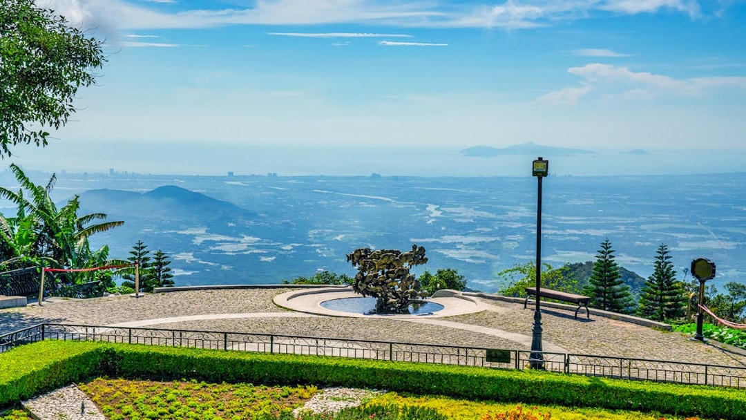 Sun World Ba Na Hills view with sculpture and distant landscape from cable car station.