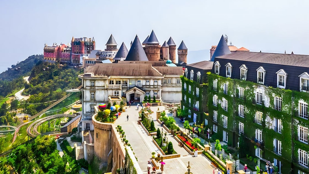 Sun World Ba Na Hills castle-like buildings and gardens with cable car in Da Nang, Vietnam.