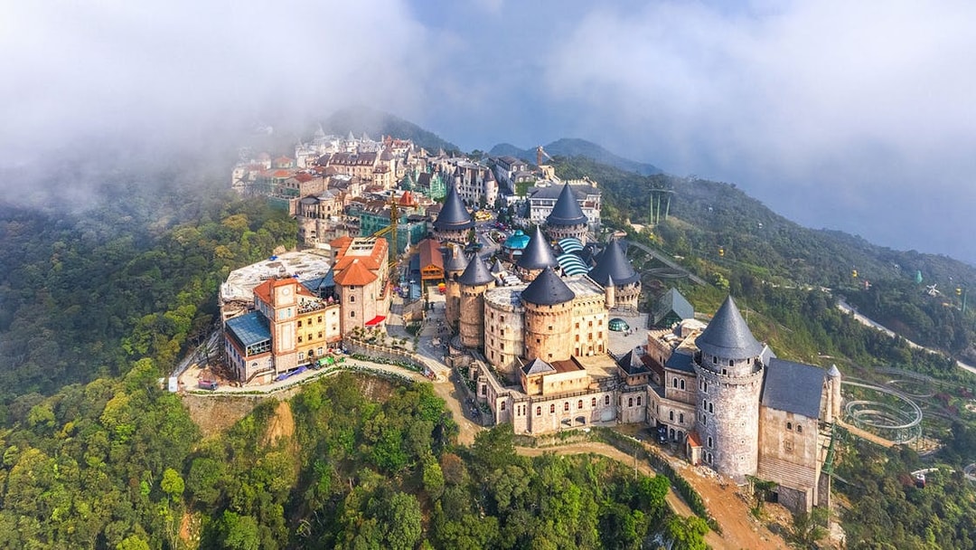 Aerial view of castles on Bana Hills shrouded in fog, Da Nang, Vietnam.