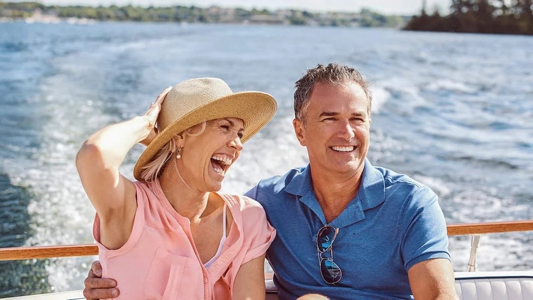 Couple enjoying a boat ride on a Sunset Cruise in South Beach, Biscayne Bay.