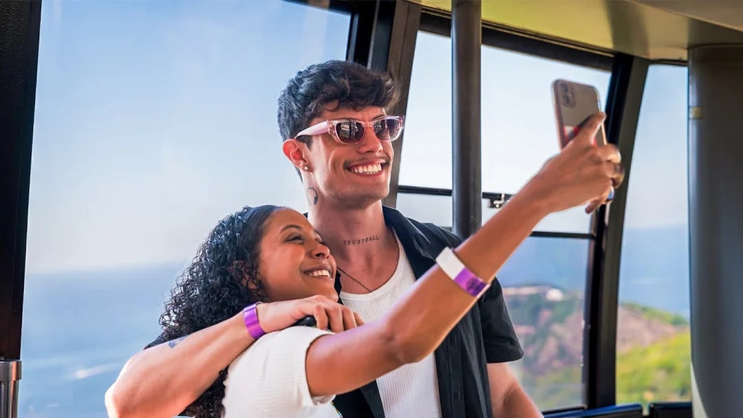 Guests taking a selfie inside the cable car to Sugarloaf Mountain, Rio de Janeiro.