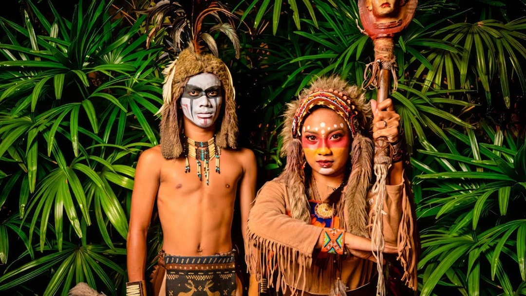 Performers in traditional costumes at Sunway Lagoon Night Park.