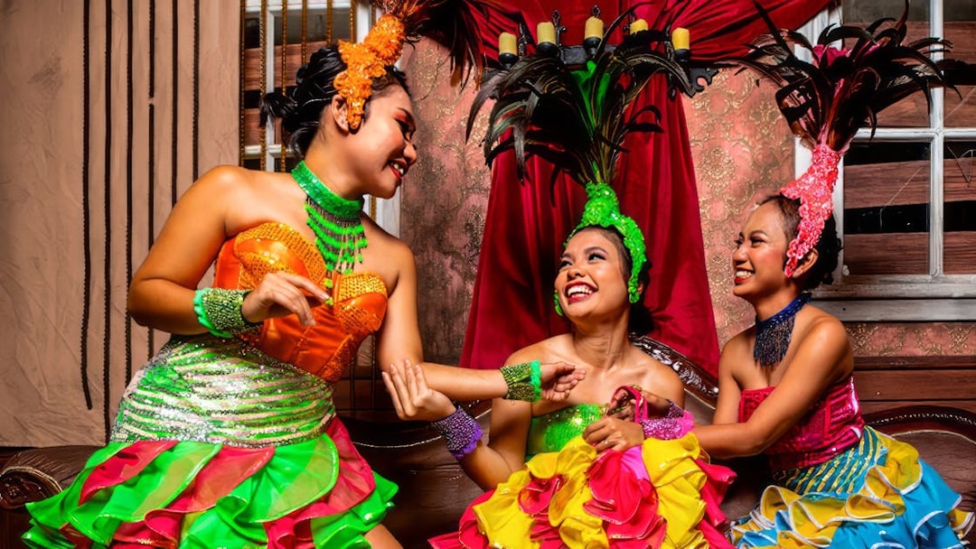 Performers in colorful costumes at Sunway Lagoon Night Park.