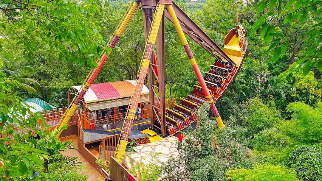 Sunway Lagoon amusement park ride surrounded by lush greenery.