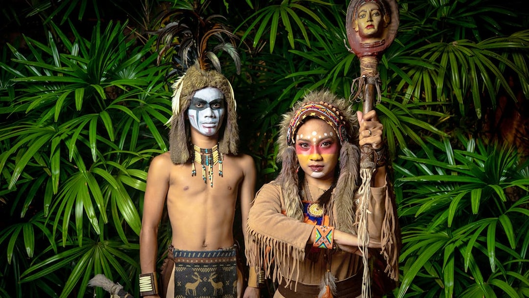 Performers in traditional costumes at Sunway Lagoon night park.
