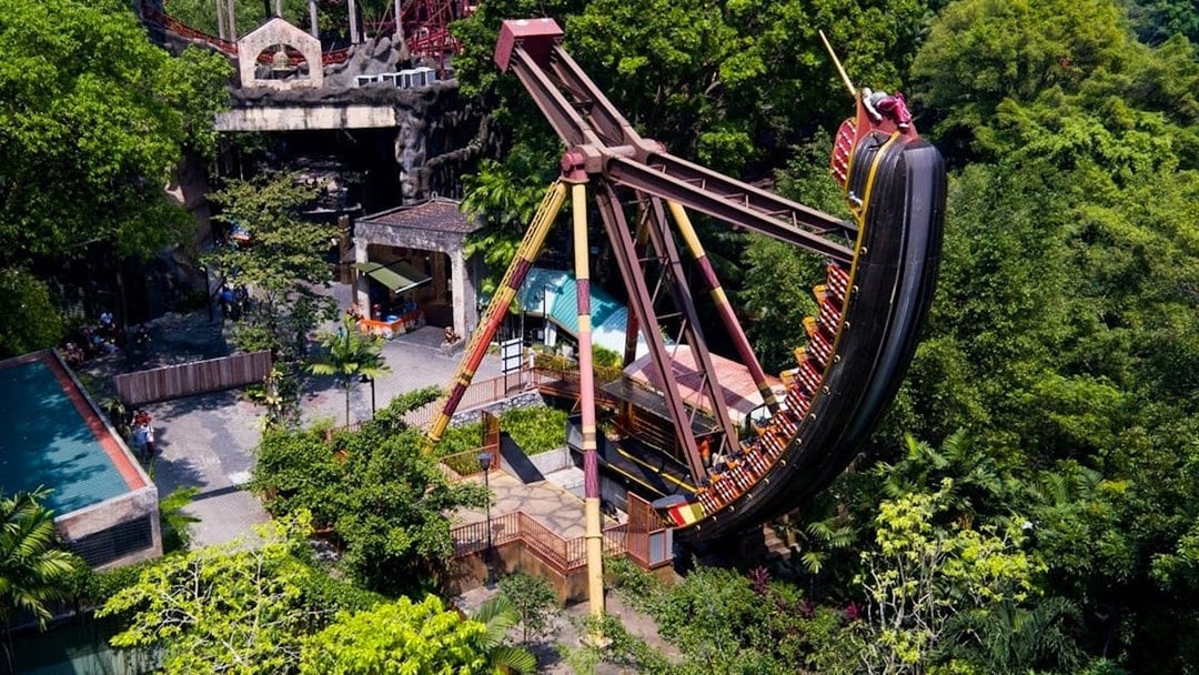 Sunway Lagoon amusement park ride surrounded by lush greenery.