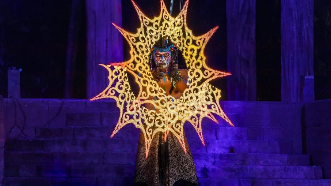 Performer with glowing patterns at Sunway Lost World Hot Springs Night Park.