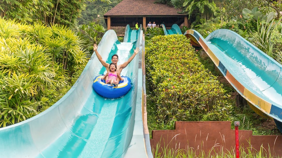 Visitors enjoying a water slide at Sunway Lost World of Tambun, Malaysia.