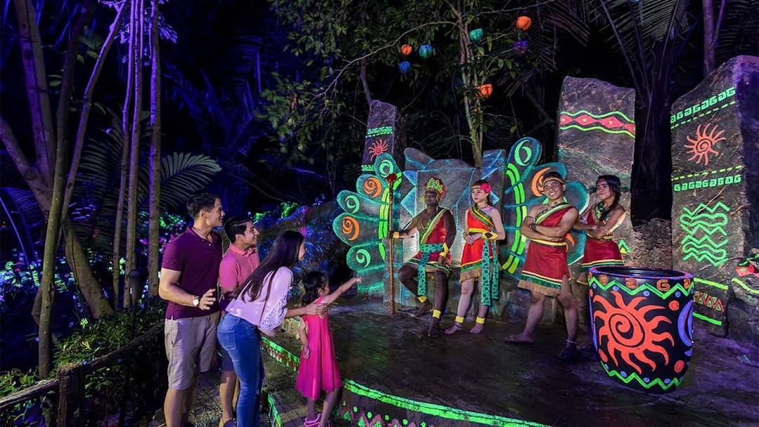Visitors enjoying a cultural performance at Sunway Lost World of Tambun, Malaysia.