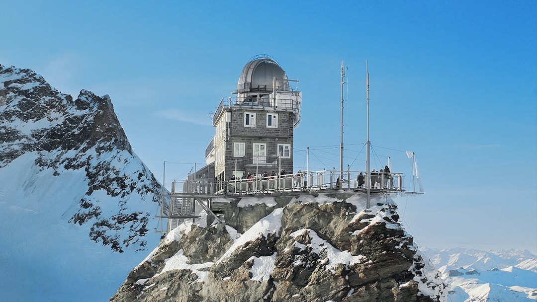 Jungfraujoch observatory on snowy peak, accessible with Swiss Travel Pass.
