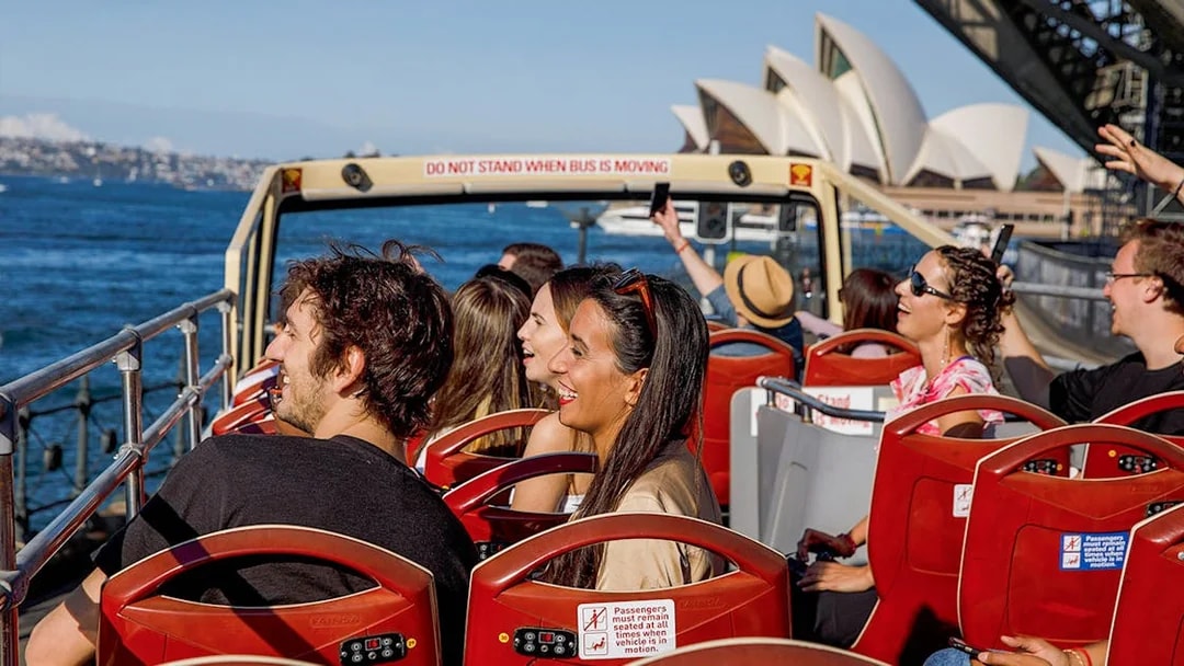 Passengers on Big Bus Sydney near Sydney Opera House.