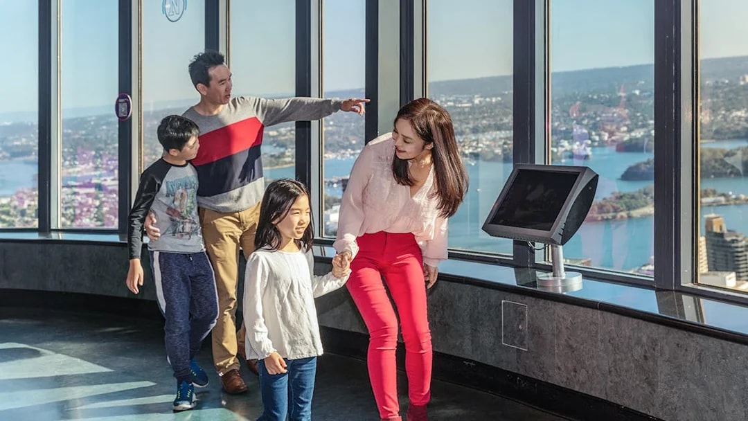 Family enjoying the view from Sydney Eye Tower observation deck.
