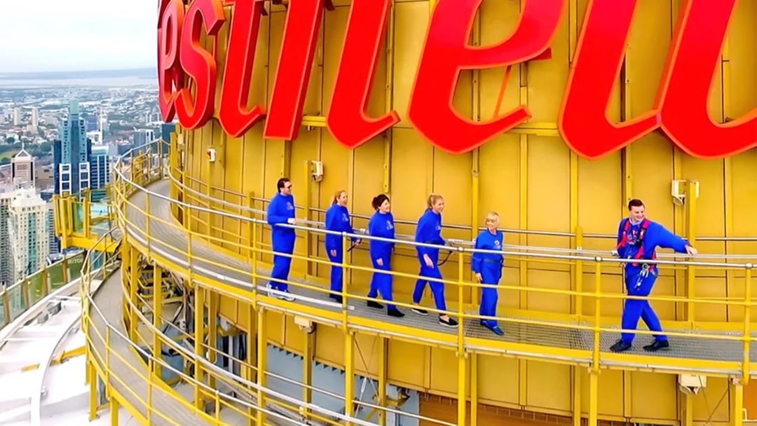 Visitors walking on the Sydney Tower Eye observation deck.