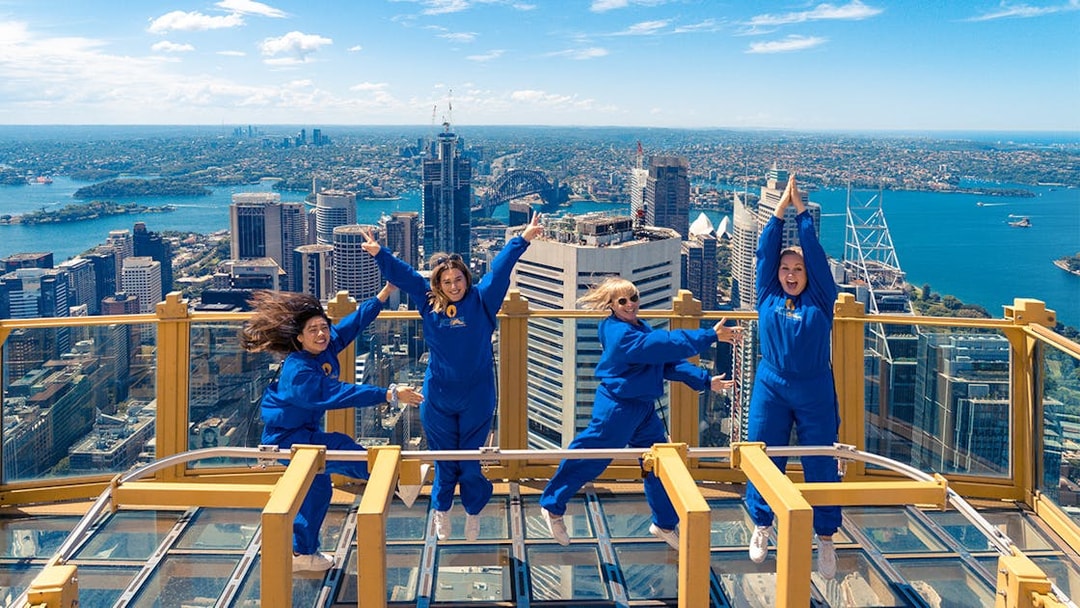 Visitors enjoying the view from Sydney Tower Eye's outdoor platform.