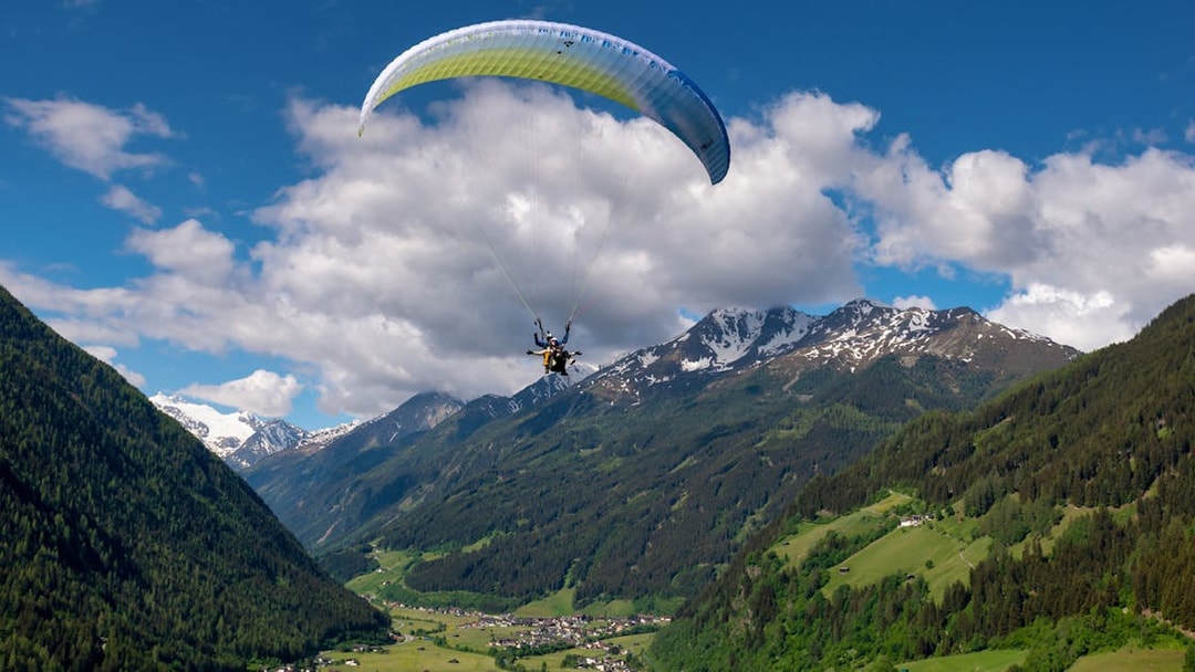 Tandem paragliding over the scenic mountains of Tirol, Austria.