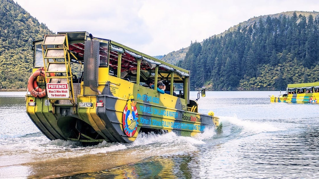 Amphibious tour vehicle entering lake during Rotorua City & Lakes Tour.