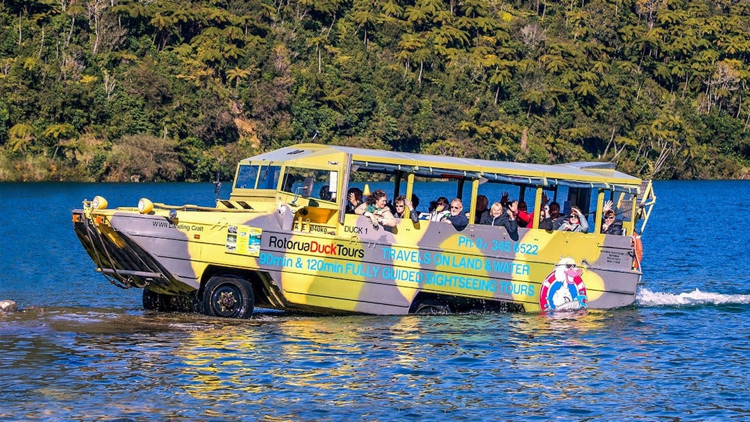 Amphibious tour vehicle on Rotorua Lake with passengers enjoying the Rotorua City & Lakes Tour.