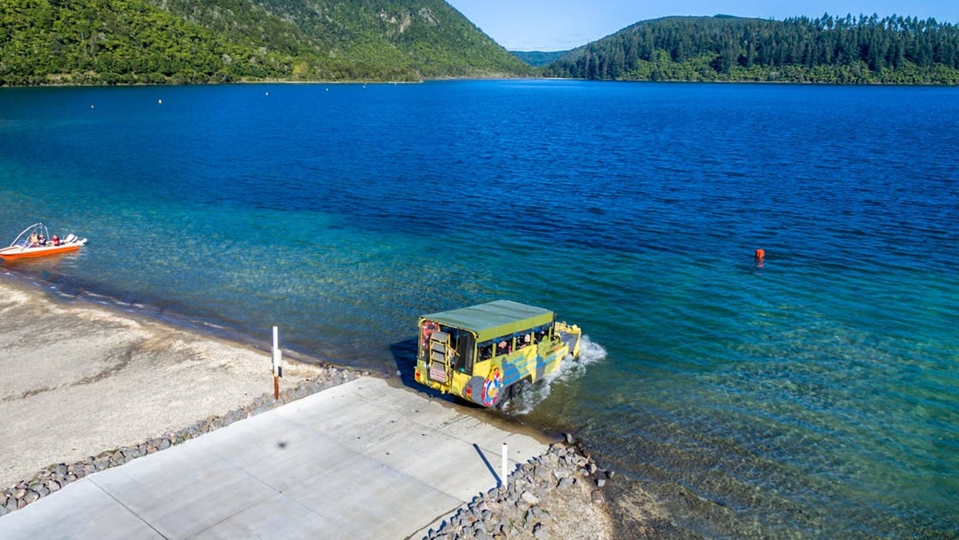 Amphibious vehicle entering Lake Rotorua during city and lakes tour.
