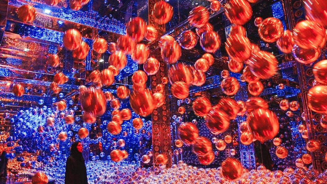 Interactive art installation with floating spheres at Team Lab Abu Dhabi.