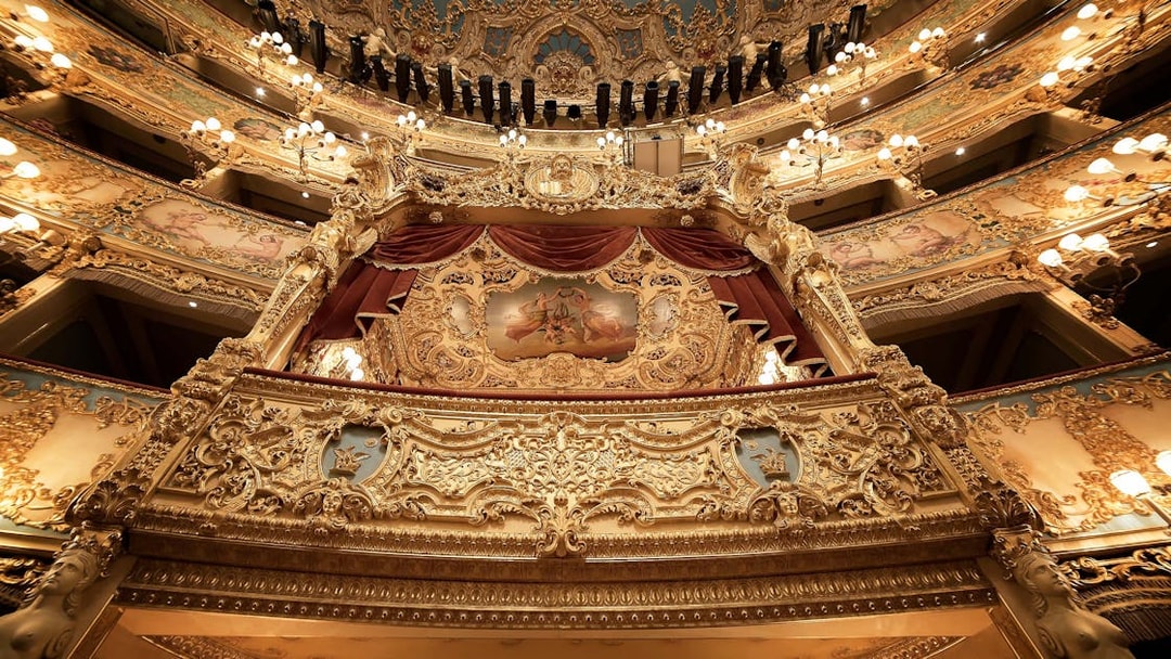 Teatro La Fenice's ornate interior with golden balconies in Venice.