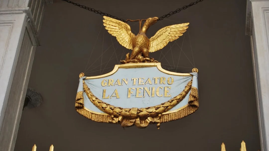 Gran Teatro La Fenice sign with golden eagle in Venice, Italy.