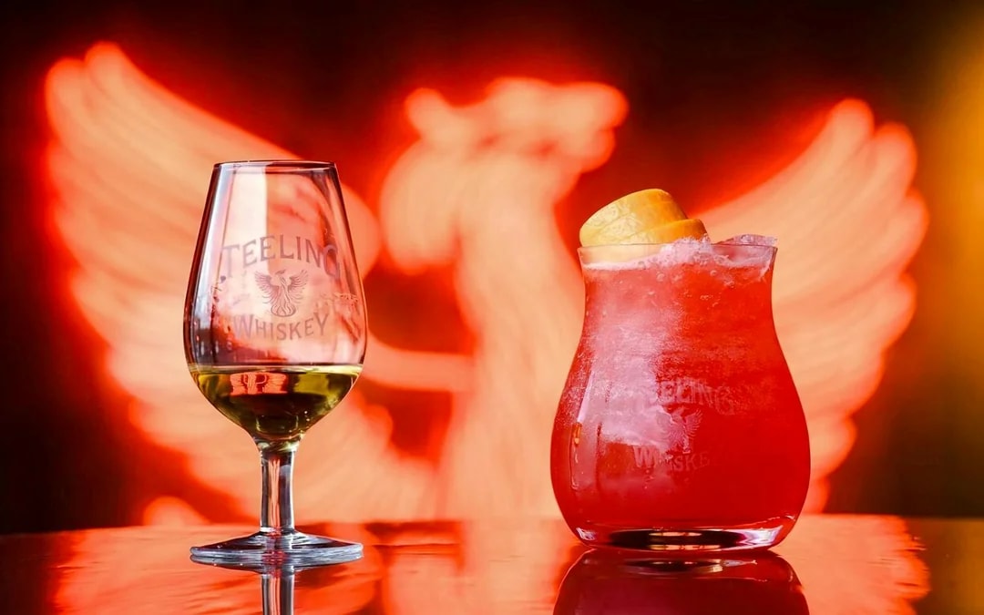 Teeling Whiskey glass and cocktail with orange garnish at Teeling Whiskey Distillery.