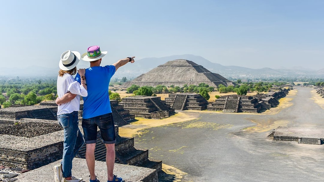 Tourists viewing Pyramid of the Sun at Teotihuacán, Mexico.