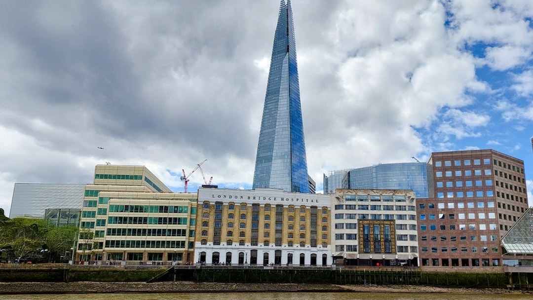 The Shard and London Bridge Hospital viewed from the Thames on a sightseeing cruise.