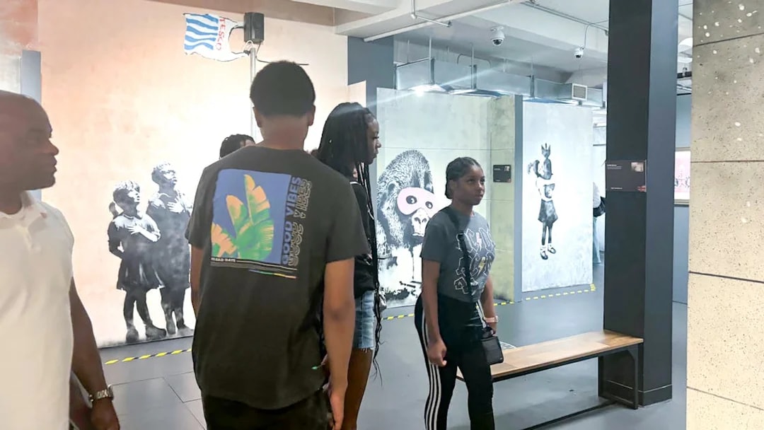 Visitors exploring Banksy artwork at the Banksy Museum.