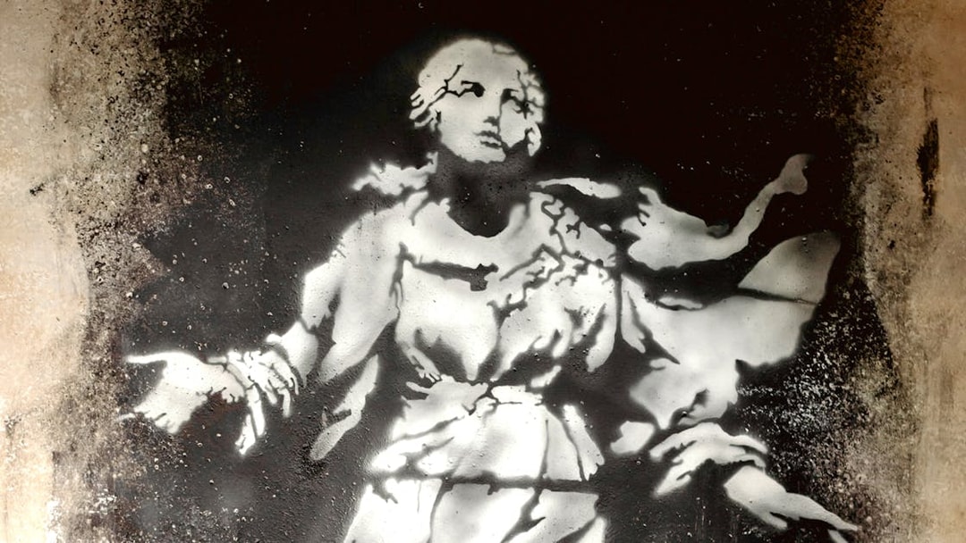 Banksy-style stencil art of a classical figure at the Banksy Museum.