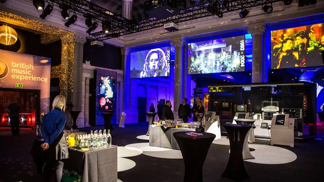 British Music Experience interior with exhibits and video displays.