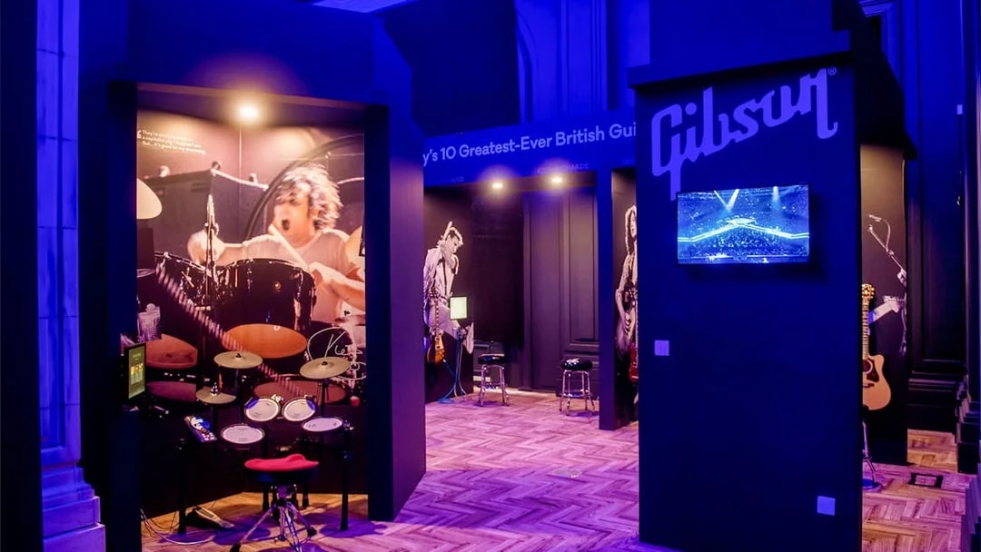 Drum exhibit at The British Music Experience, featuring iconic British musicians.