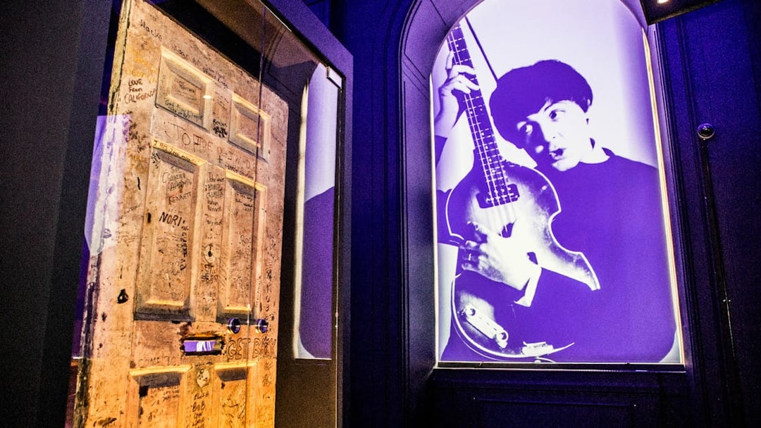 Graffitied door and musician projection at the British Music Experience.